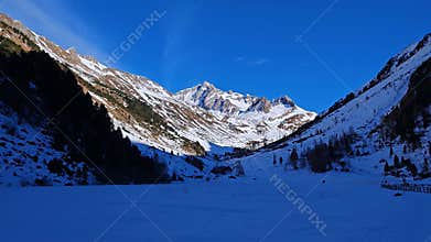 Wonderful valley with snow in Riva di Tures during winter season with high alps in the background