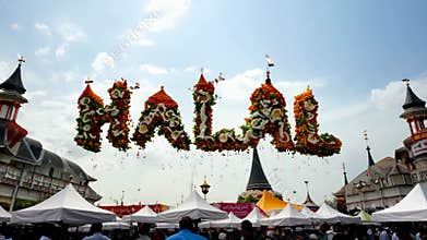 A large sign with the word \"halal\" written in a flowery font. The sign is
