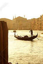 Venice gondola with gondolier at golden hour