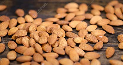 ready-to-eat almond nuts on a wooden table