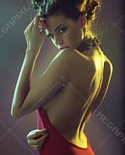 Sensual brunette woman clothed red dress