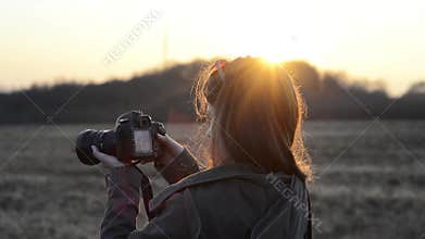 Girl with camera sunrise