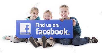 Children holding Facebook find us sign