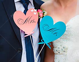 Couple show hearts with text MR and MRS
