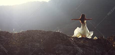 Beautiful woman spinning with arms open