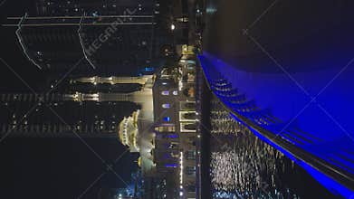 UAE, Dubai, 10 December 2024: Mosque of Muhammad Ibn Ahmad Al-Mullah against the backdrop of skyscrapers at night in