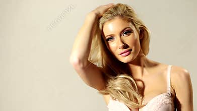 Close up Happy Blond Girl Touching her Hair