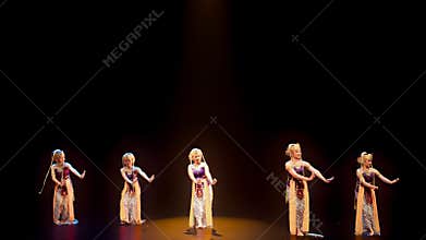 Symmetrical Traditional Dance Formation on Spacious Theater Stage