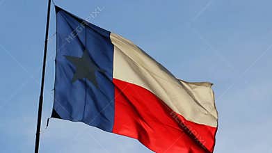 Texas flag fluttering in the evening sunshine