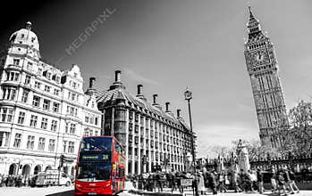 Red bus in Lodon street view with Big Ben in panorama , black and white