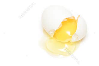 Cracked egg over white