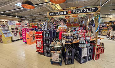 UBERLINGEN, GERMANY - SEPTEMBER 30, 2026: Wide view of Oktoberfest retail display tent with Paulaner and Hacker Pschorr