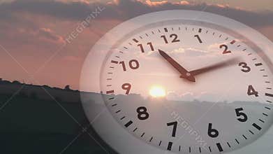 Ticking clock over sunset