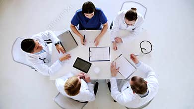 Group of doctors with cardiogram at hospital