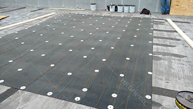 roof leak repairs in progress on Commercial flat roof; roofing