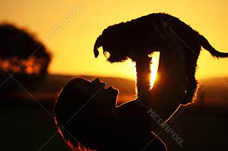 Young woman shows joy & happiness when lost puppy dog found safe