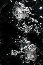 Air bubbles rising in water