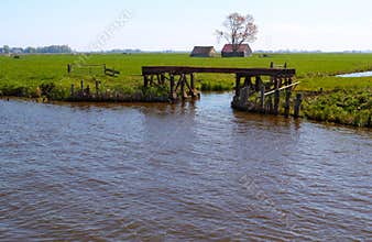 Dutch countryside with waterway and gateway