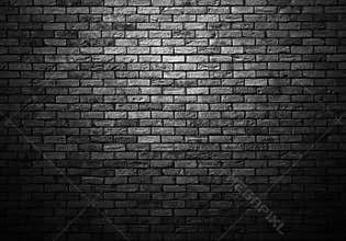 Dimly lit old brick wall