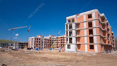 Tower cranes build large residential building in