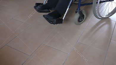 Man in a wheelchair in care home