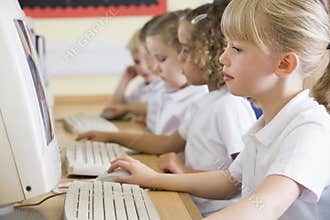 Girl working on a computer at primary school