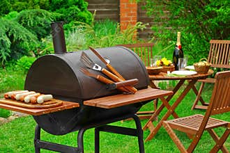 Summer Weekend BBQ Scene With Charcoal Grill On The Backyard