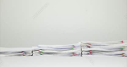 Step pile overload document of report on white table time lapse
