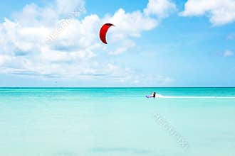 Kite surfer surfing on the Caribbean Sea at Aruba