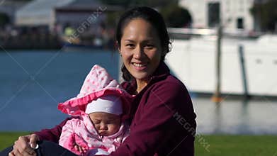 Slow motion of Asian Mother and baby outdoors