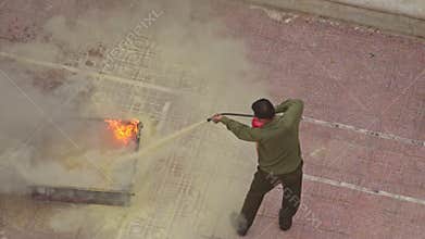 Closeup Fire Brigade Training Man Extinguishes Model Fire