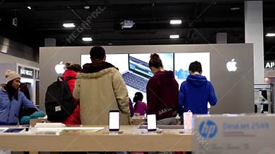 Motion of people playing apple products