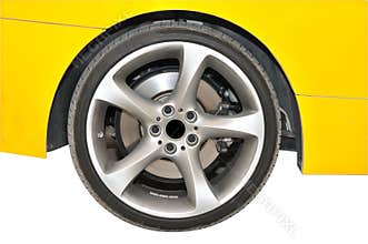 Golden color car - tire close up view