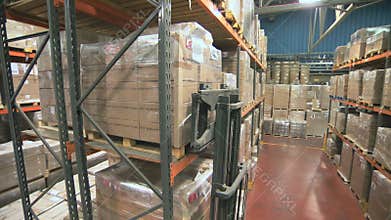 Crane shot of a forklift working in a large warehouse
