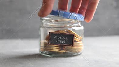 MUTUAL FUNDS idea - text and coins