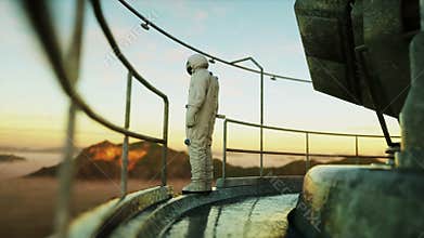 Alone astronaut on alien planet. Martian on metal base. Future concept. 4k