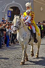 Man and child on the horse, in traditional national costumes at the parade - Celebration Days of Brasov City, landmark in Romania