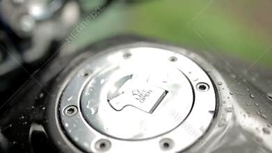 After car wash or rain, close up water drops on motorcycle hood