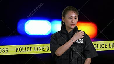 Asian American Policewoman using police radio