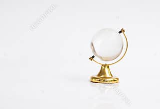 Transparent globe object with gold base