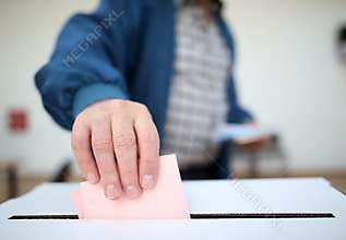 Man casts his ballot at elections