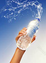 Hand holding a bottle of water
