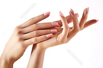 Beautiful woman`s hands on light background. Care about hand. Tender palm. Natural manicure, clean skin. Pink nails