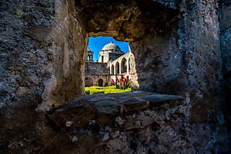 The Historic Old West Spanish Mission San Jose, Founded in 1720, San Antonio, Texas, USA. Showing dome, bell tower, and cross in