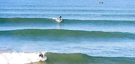 Stand up paddle Surfer at a surf break in morocco 4