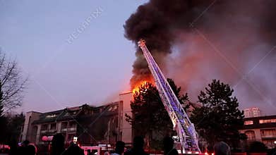 Firefighter crews battling apartment complex fire at night