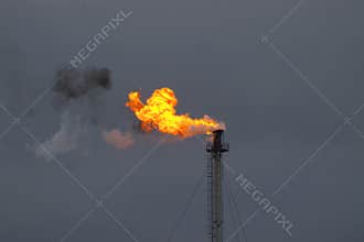 Smoking flame from industry