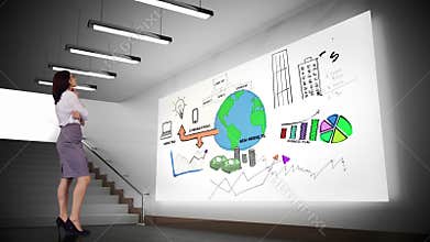 Businesswoman looking at brainstorm on screen