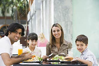 Family enjoying lunch at cafe