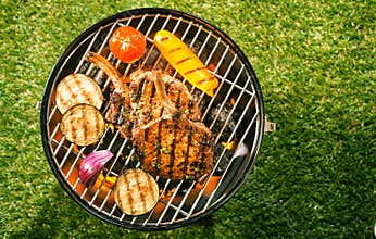 Healthy lean pork loin with veggies on a BBQ